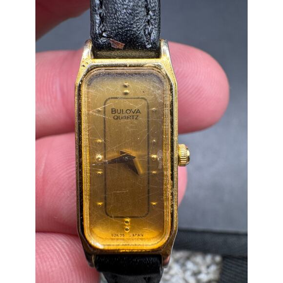 Vintage Bulova Quartz Slim Dial Watch Rectangular Face Gold Tone Black Leather - Picture 1 of 9
